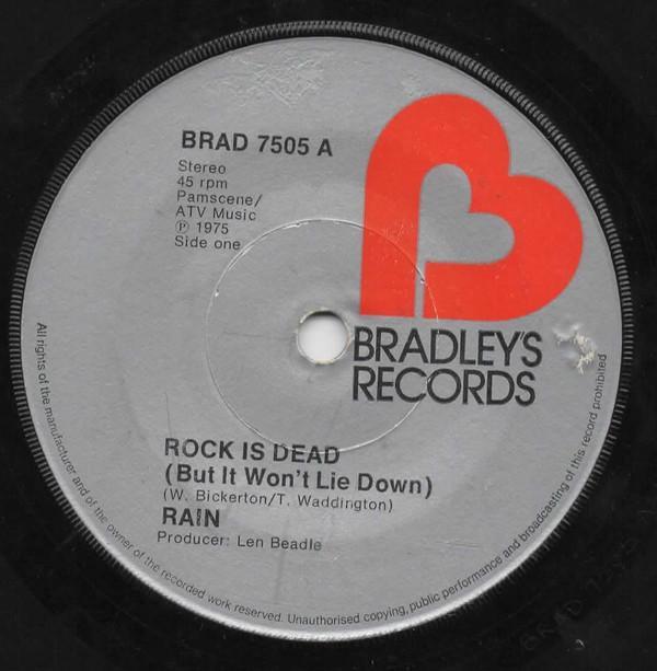 Rain (17) - Rock Is Dead (But It Won't Lie Down)